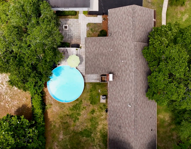 An aerial shot of a property with a pool
